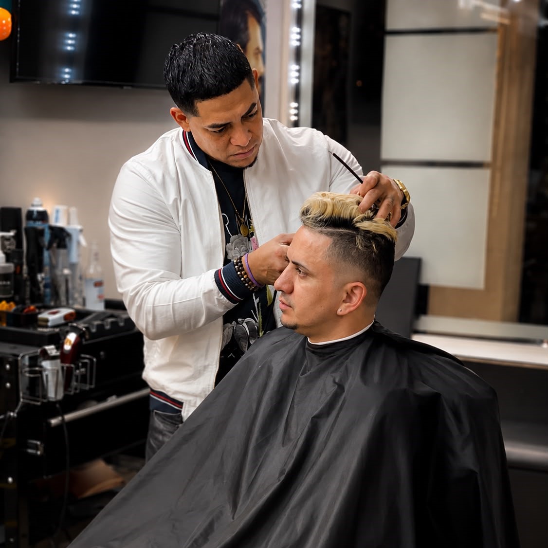 Master barber at Empire Miami giving a precision haircut